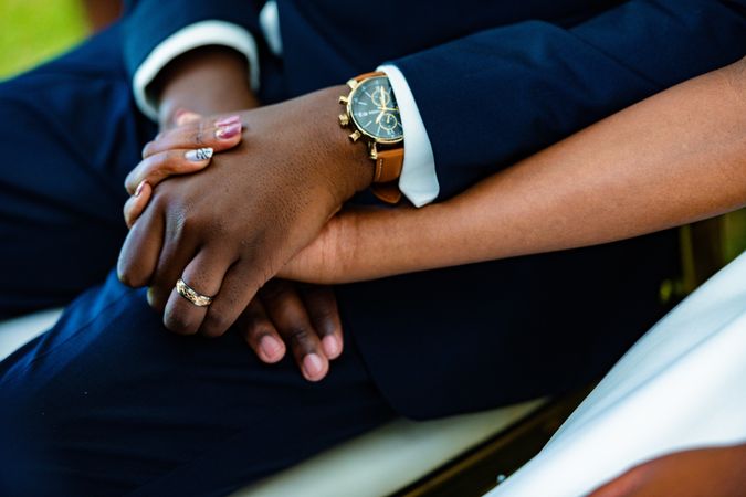 Couple Bride and Groom Holding Hands at Wedding Celebration