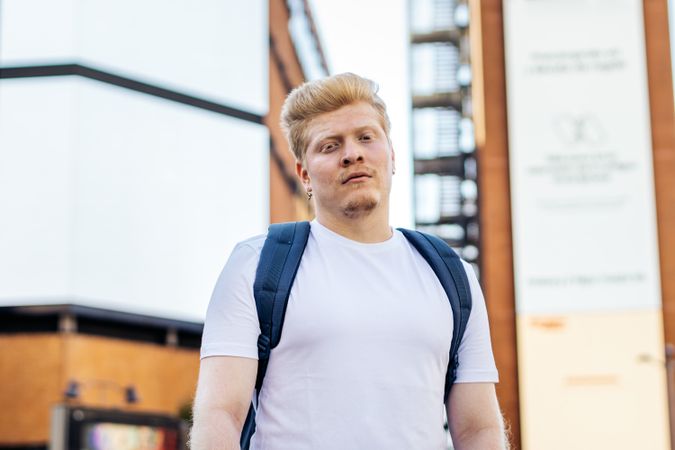 Portrait of a young Latino man with albinism in the city