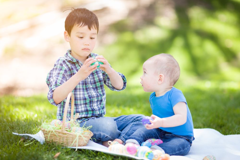 Boys in Park Playing with Easter Eggs