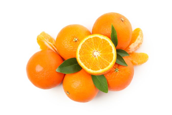 Group of ripe mandarins isolated on light background