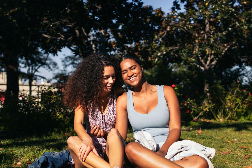 Girlfriends talking and enjoying in a park