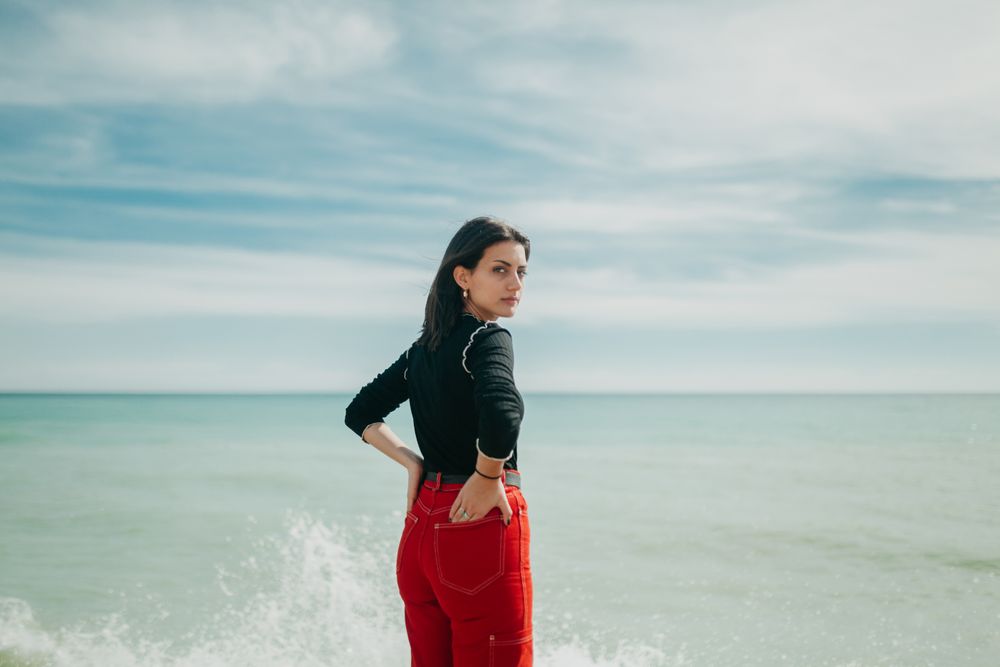 woman at sea looking at camera