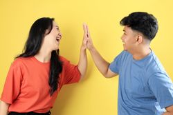 Two People Young Asian Friend Hi Five with Happy Excited Face