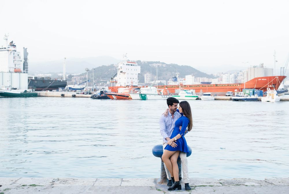 Loving couple embracing on urban pier with dock