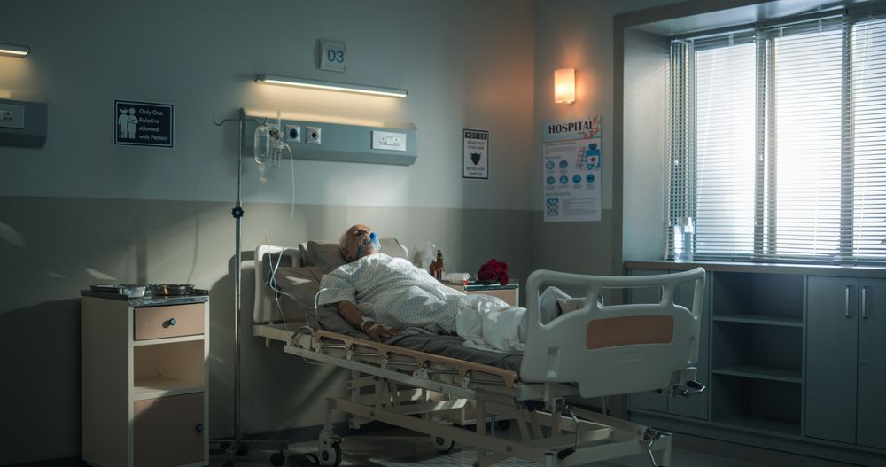 Hospital Ward: Portrait of Indian Mature Man Wearing Oxygen Mask Sleeping in Bed, Recovering after Sickness and Successful Surgery.