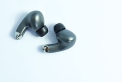Wireless earbuds on plain table