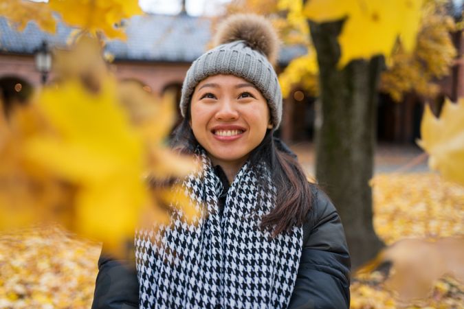 Happy female tourist enjoying autumn in Oslo