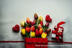 Red bag of tulips with present and heart ornaments 5RVVdr