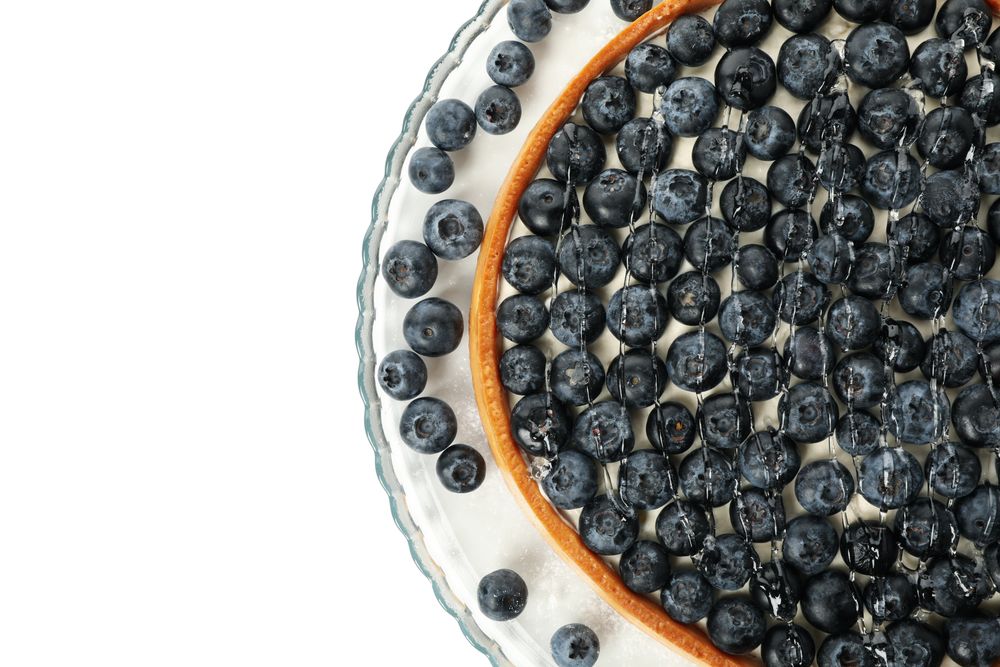 Tray with blueberry pie isolated on light background