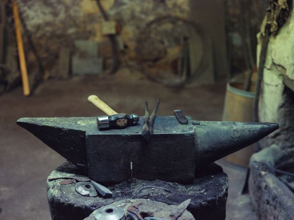 Anvil with hammer and tongs in forge