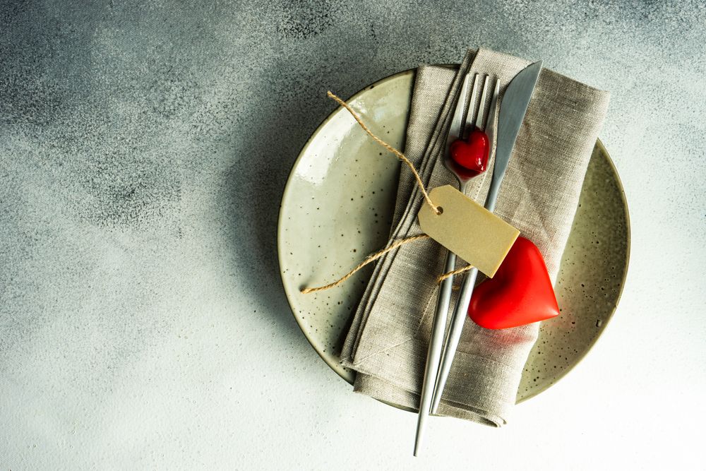 St. Valentine day card table setting with blank tag and space for text