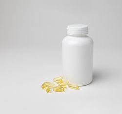 Mockup of a bottle of omega 3 capsules, food supplement, with copyspace