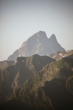 Majestic mountains range in clouds