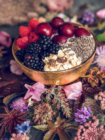 Berries and cereals in bowl of yogurt