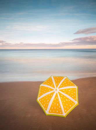 Umbrella on beach near sea