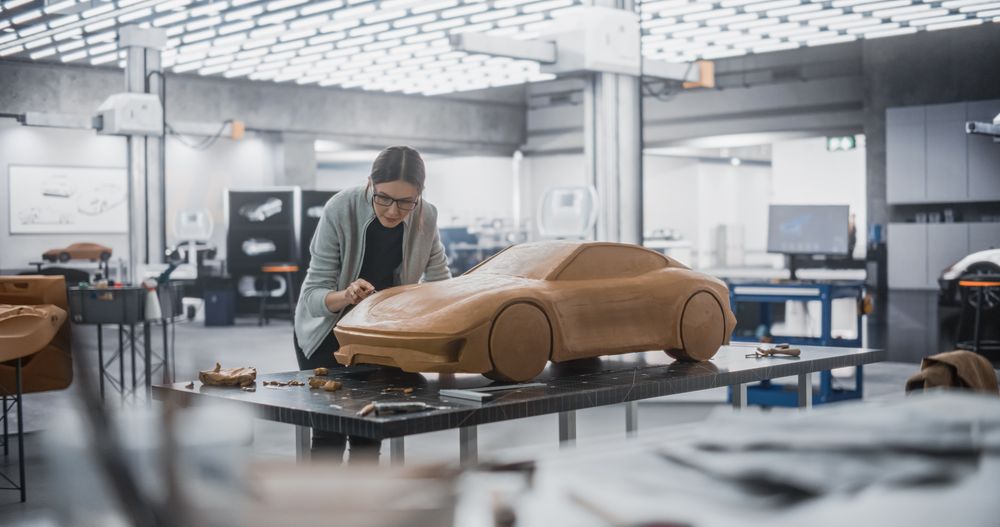 Enthusiastic Female Designer Working on a New Prototype