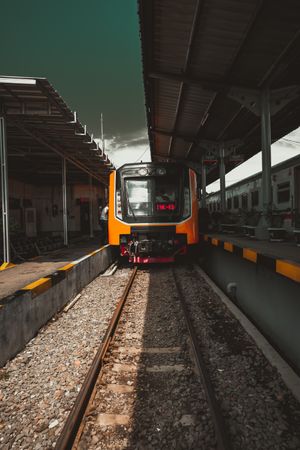 Orange train on rail