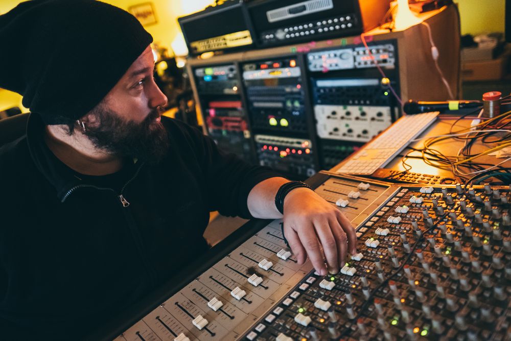 Man in a equalizer instrument in a studio