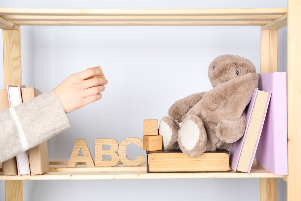 A children's book with toys on a light background.