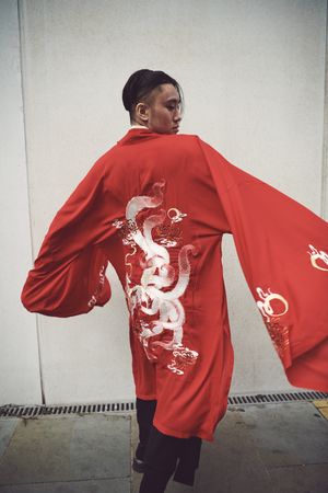 London, England, United Kingdom - September 18 2021: Back of Asian man in red robe