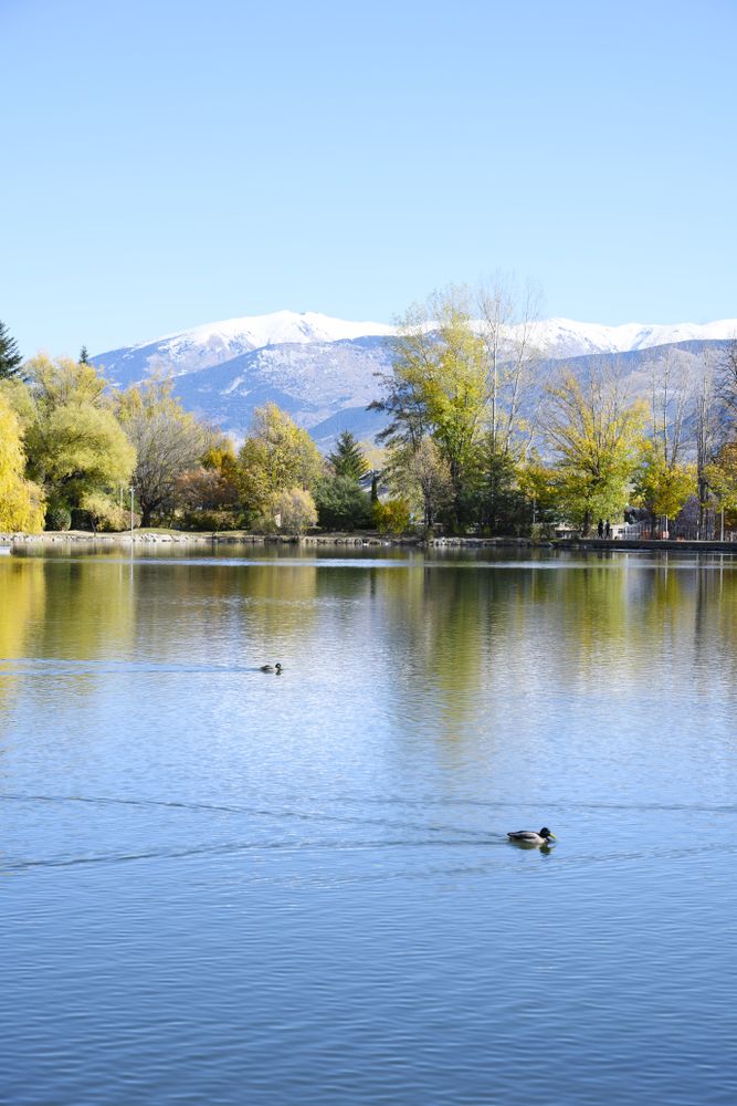 Mountain landscape, lake and mountain range, vertical