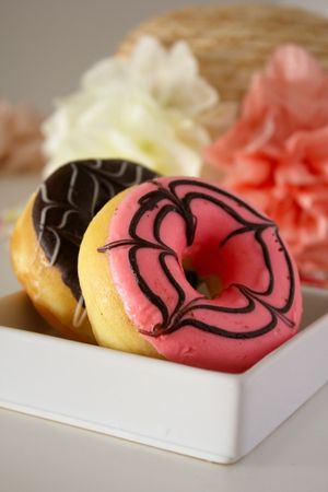 Pink and chocolate donuts.
