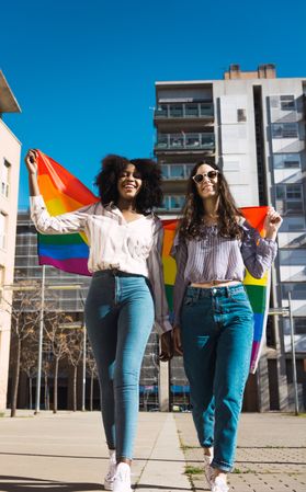 Lesbian couple with rainbow flag