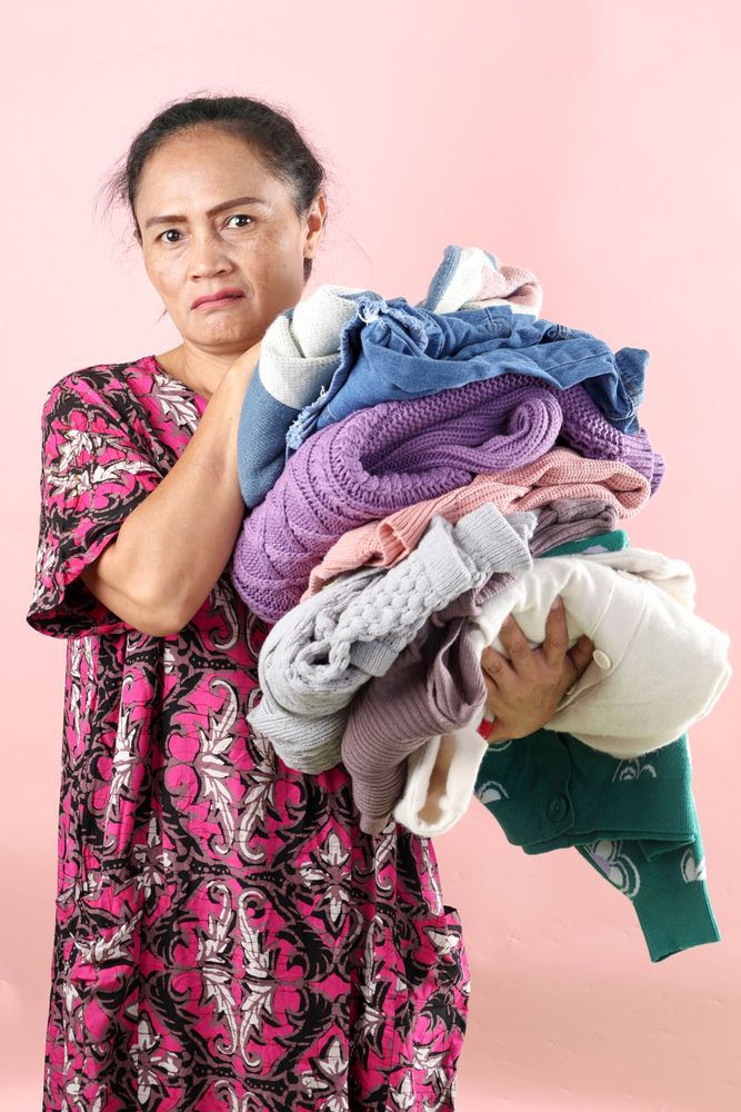 Asian Mom Holding Wrinkled Clothes Laundry with Angry Face Expression