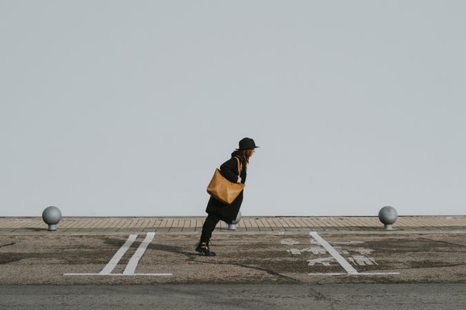 Woman balancing on street parking