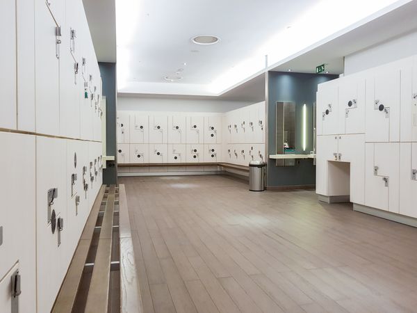 Lockers in the changing room of a gym without people