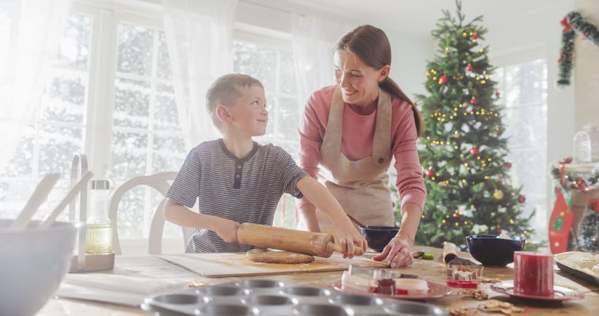 Portrait of Mother and Son Baking Together During Christmas.