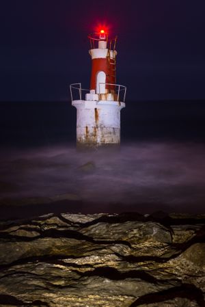 Lighthouse on rocky coastline