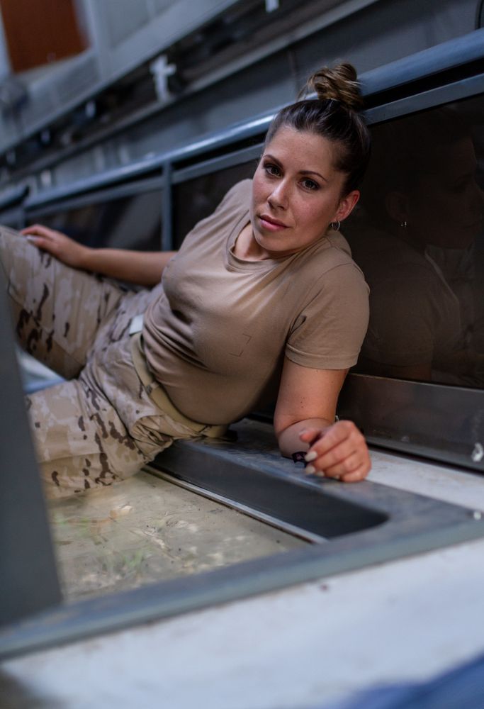 Military woman inside modern vehicle