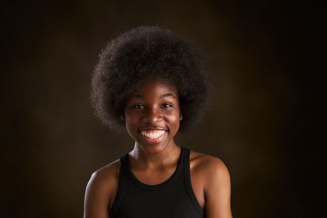 Happy young female with Afro hairstyle