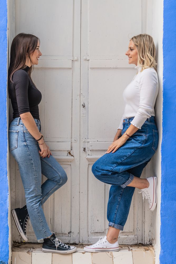Positive women standing in doorway