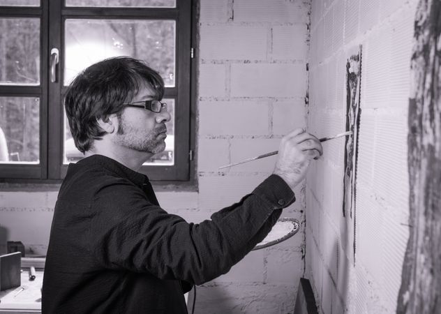 Painter artist working on a oil canvas