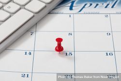 Income tax reminder on calendar with red pushpin 4199l4