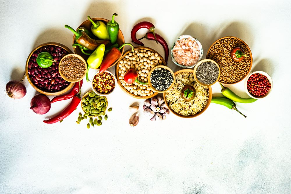 Top view of bowls of legumes and grains