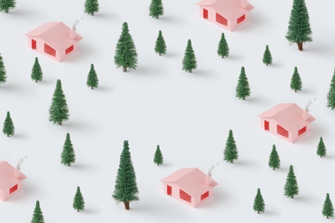 Christmas pattern made with pink houses and pine trees