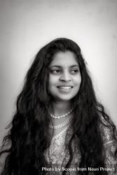 Portrait of an Indian woman smiling in grayscale bY7oj5