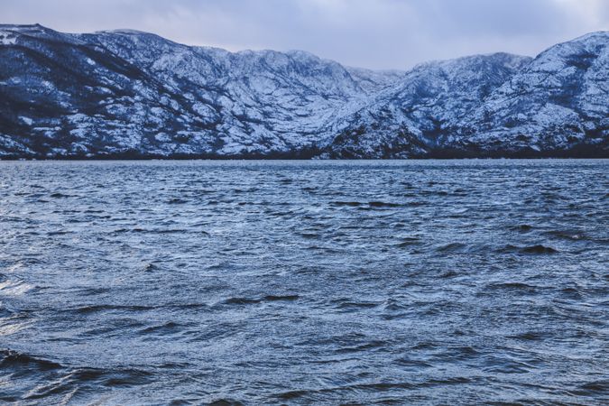 Shore with mountains near water