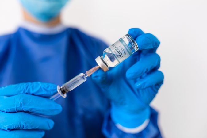 Doctor holding coronavirus vaccine
