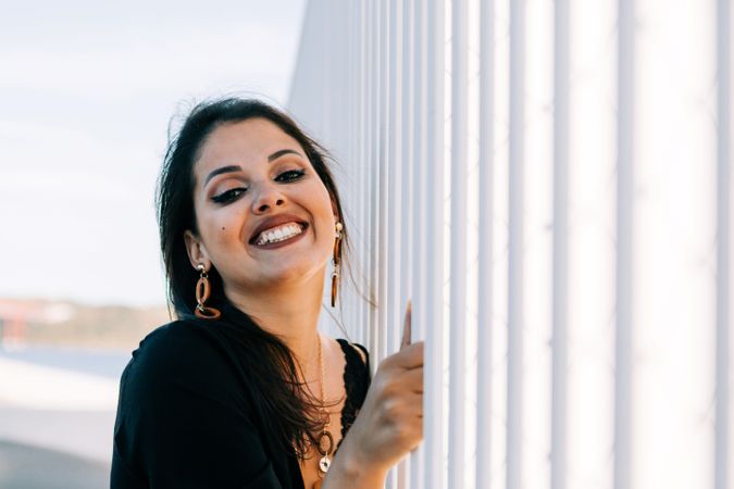 Trendy female standing on urban background