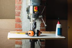 Modern drilling machine in grunge carpentry