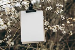 Spring wedding stationery mockup, blank greeting, birthday invitation card with metal bulldog clip