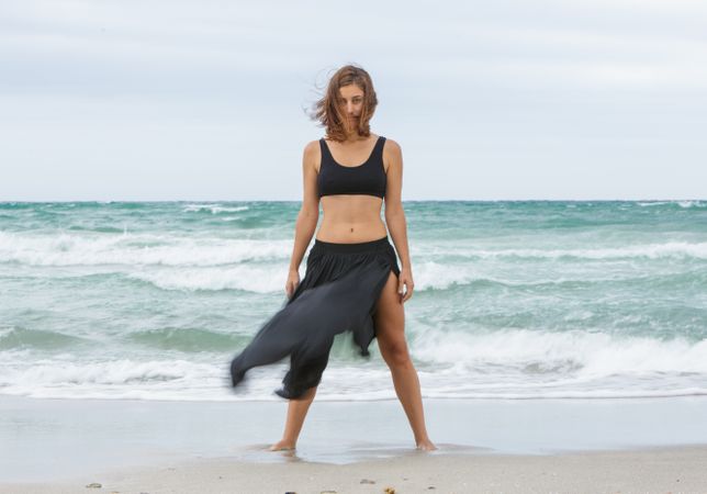 woman dancing near sea
