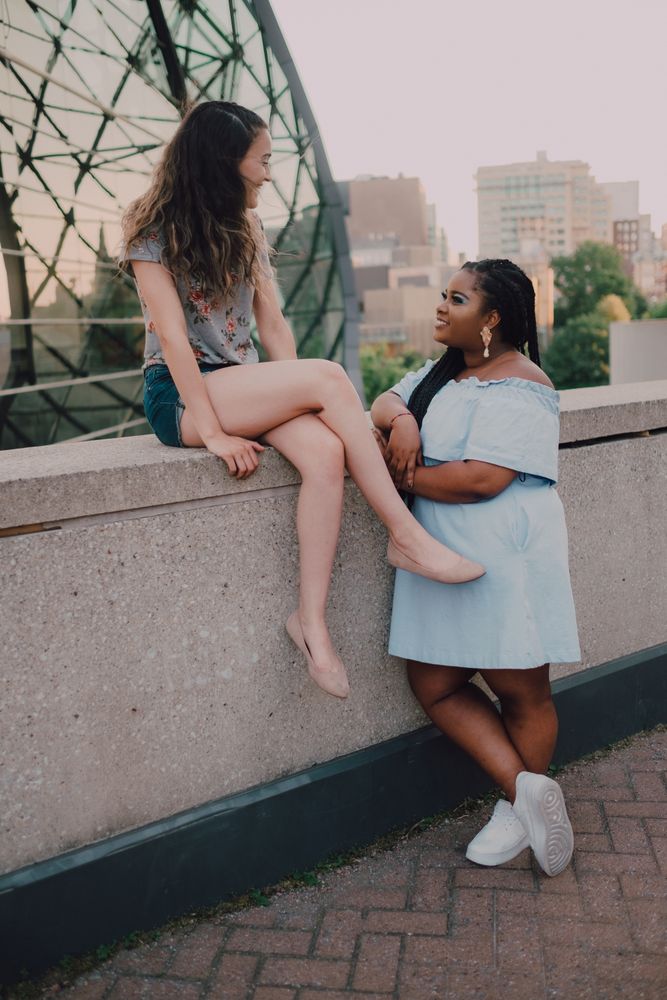 Multiethnic modern women talking on street