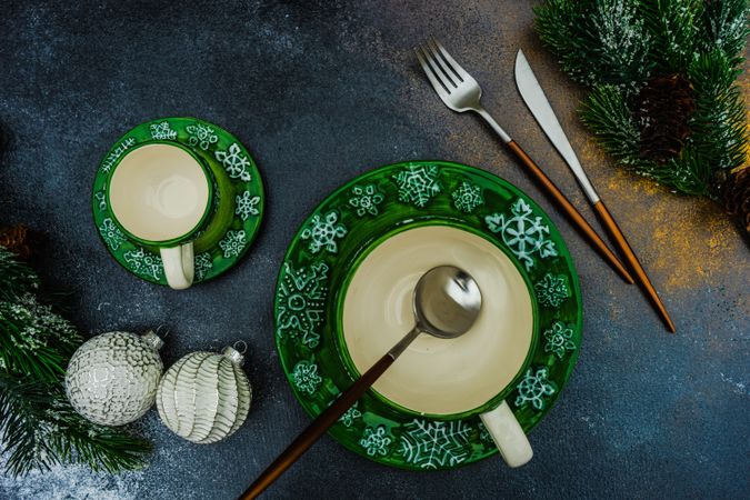 Top view of two green mugs with snowflake pattern