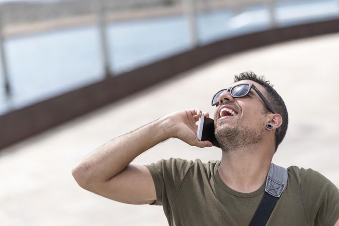 Male looking up while talking on cellphone