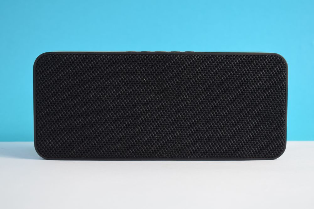 Single bluetooth speaker in blue studio shoot